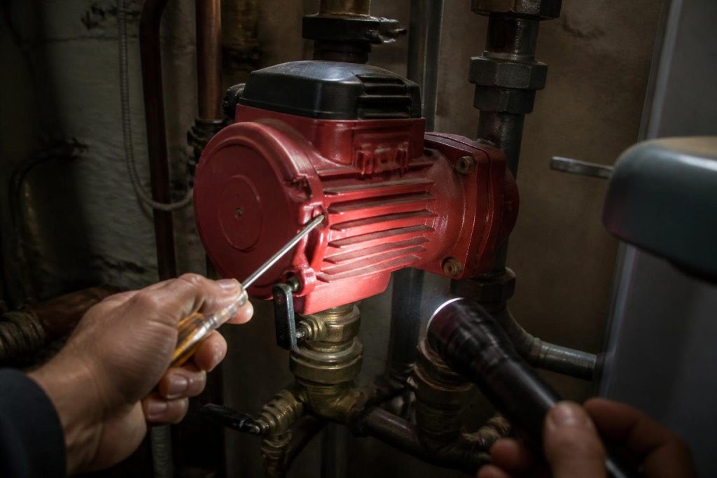 Listening to the motor housing is one of the quick checks before replacing a pump.