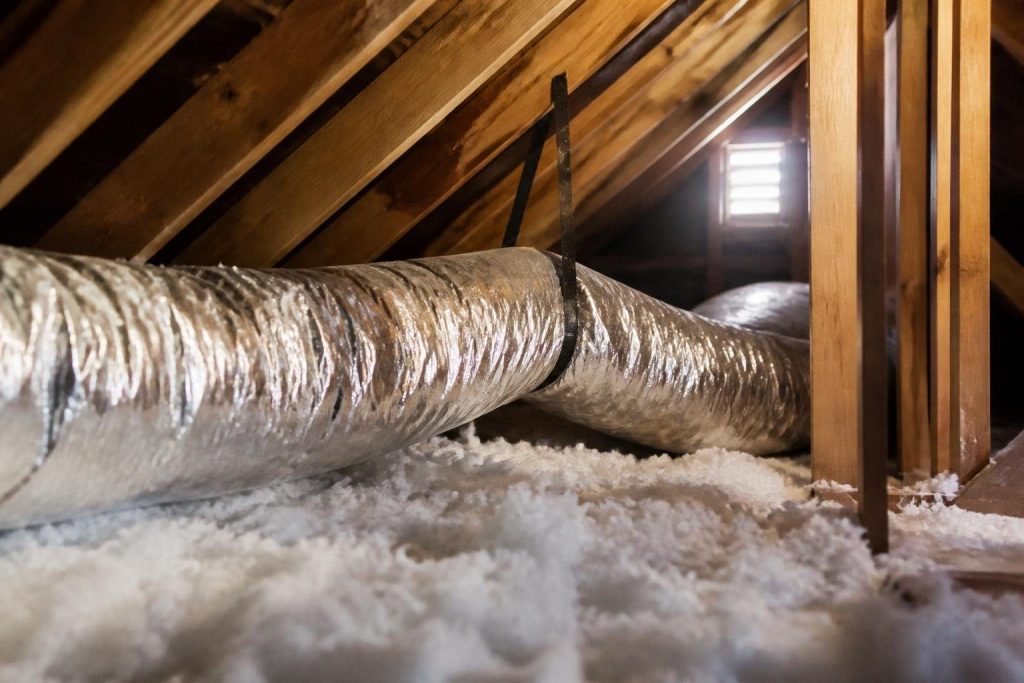 An insulated attic supply duct, where the code sets the highest R-values.