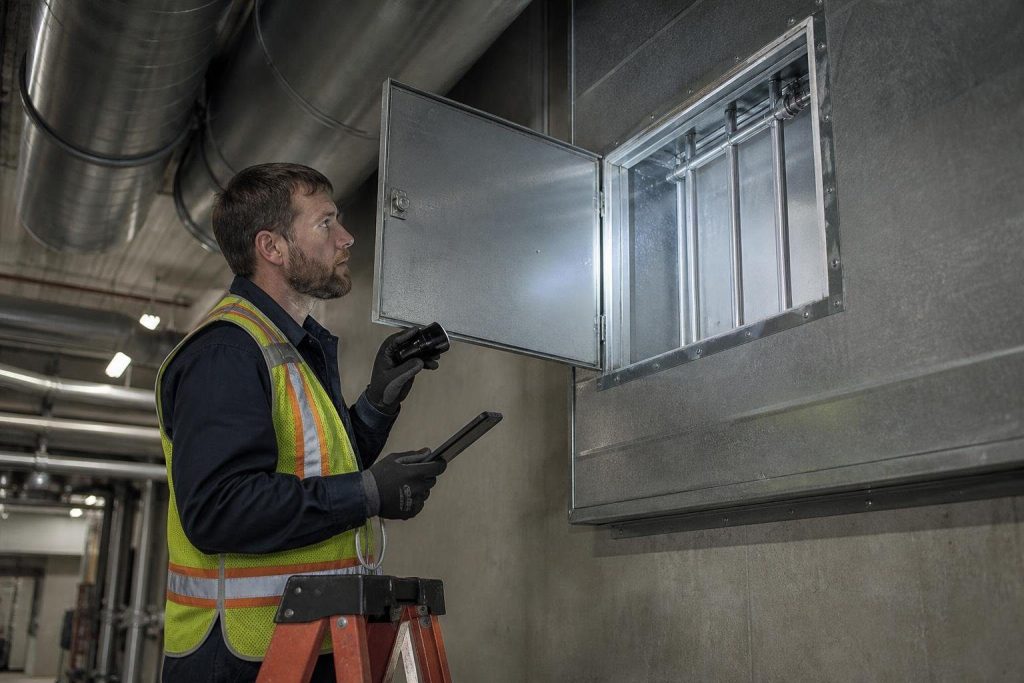 Every inspection starts with access: the damper has to be reachable through an access door.
