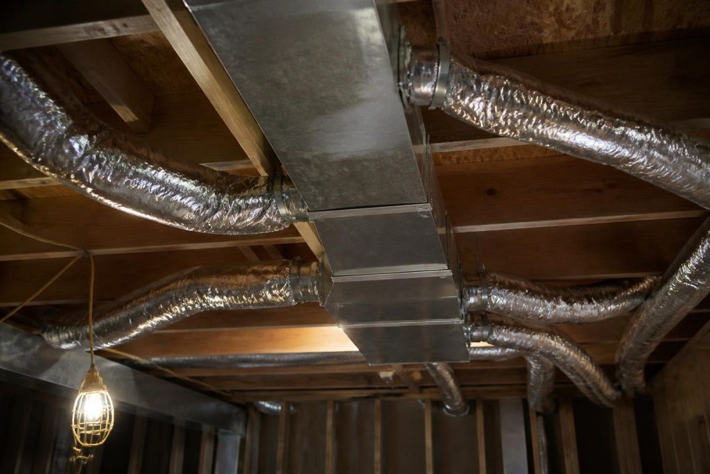 Common hybrid layout: rigid sheet metal trunk, flex duct branches.