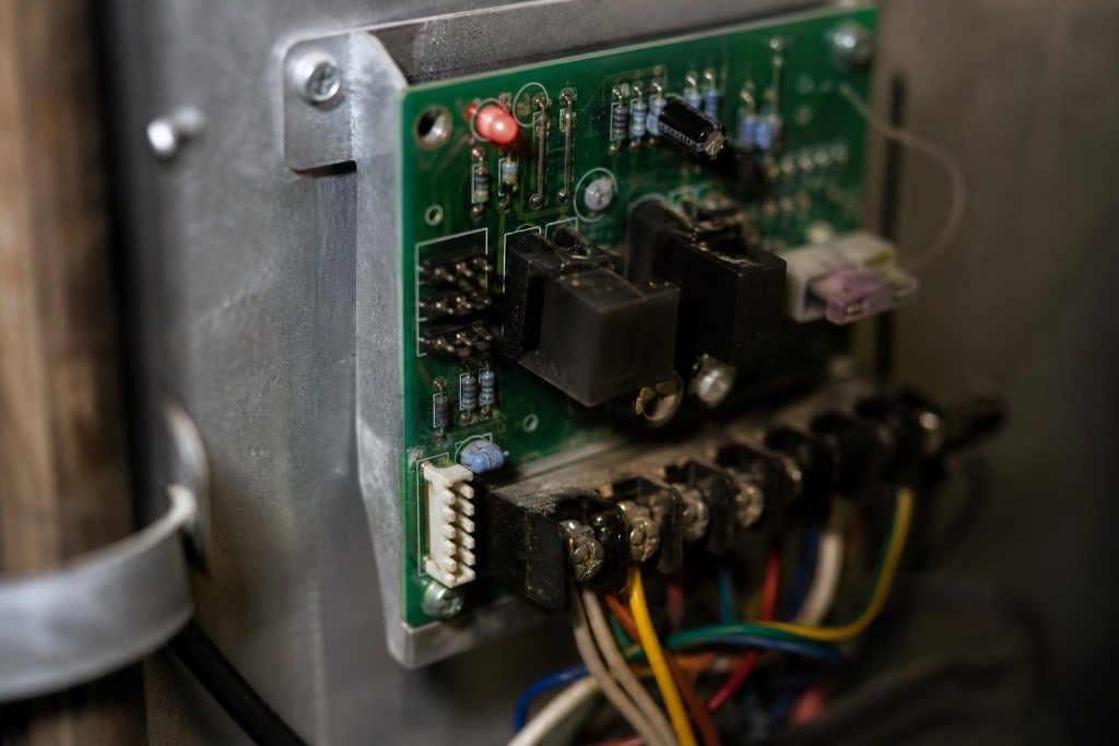 The status LED on the board flashes the fault code that the door chart translates.