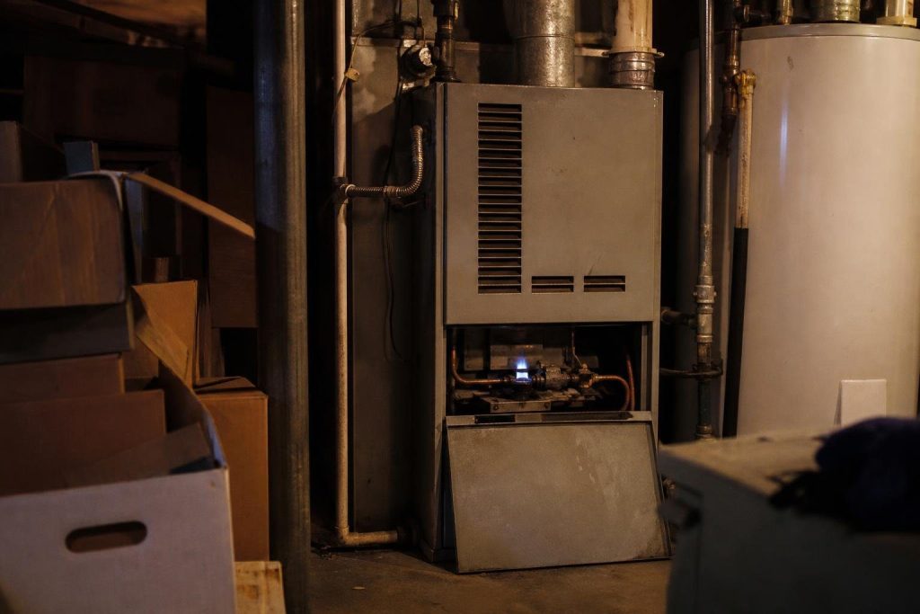 A standing pilot burns around the clock, including months when the furnace never calls for heat.