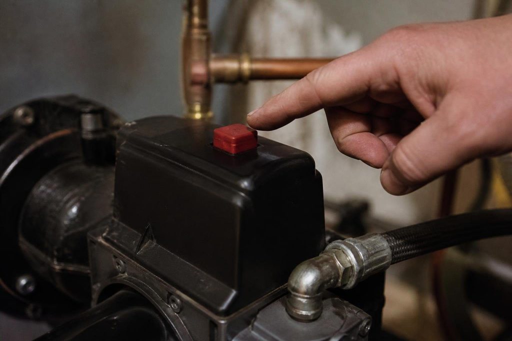 The reset button on an oil burner control. Makers limit how many times it should be pressed.