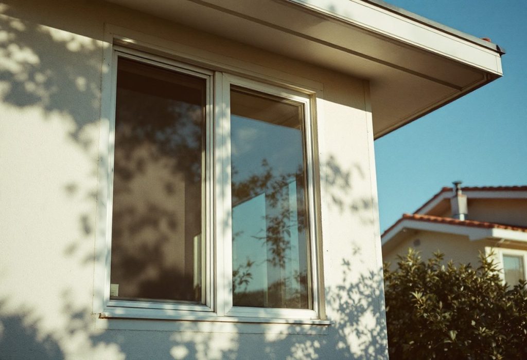 A roof overhang shading south windows from the high summer sun.