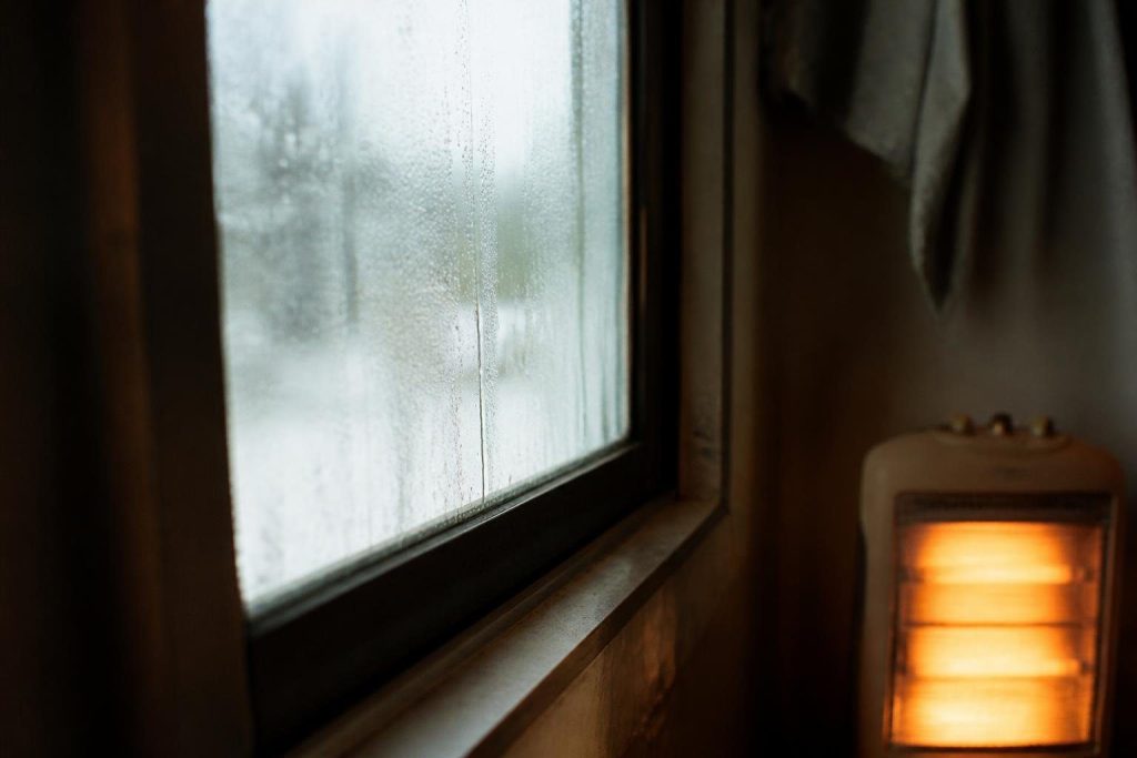 Burning propane adds water vapor, which shows up as condensation on cold windows.