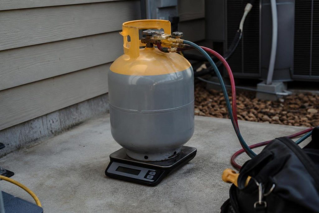 Weighing the recovery cylinder keeps it under the 80 percent fill limit.