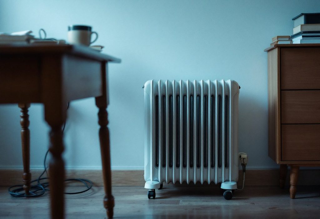A portable electric heater used as a second heat source.