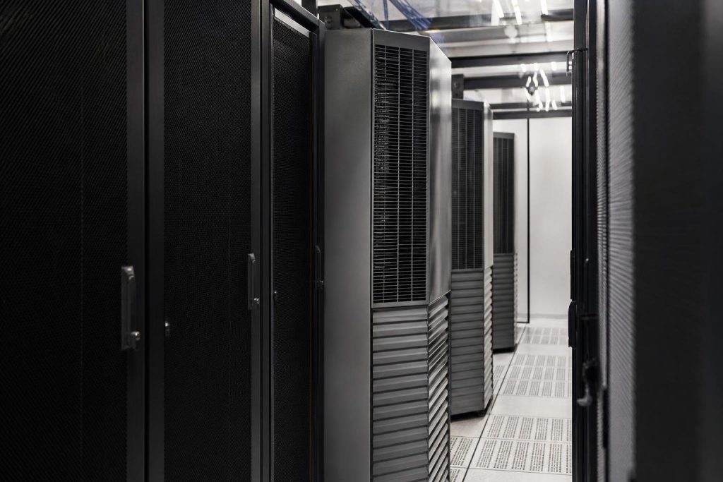 In-row cooling sits between the racks; small rooms more often rely on a dedicated mini split.