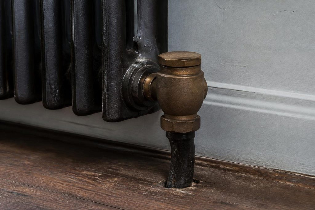 On two-pipe home systems, a small thermostatic trap sits at each radiator's outlet.