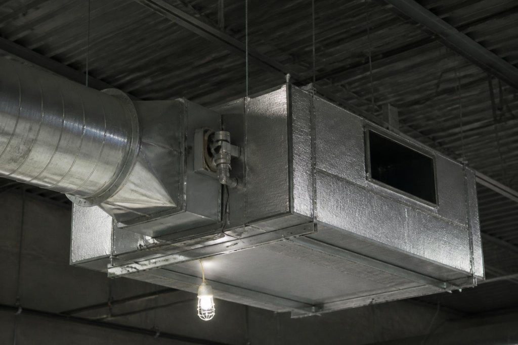 A fan-powered box adds its own small blower and mixes in ceiling plenum air.