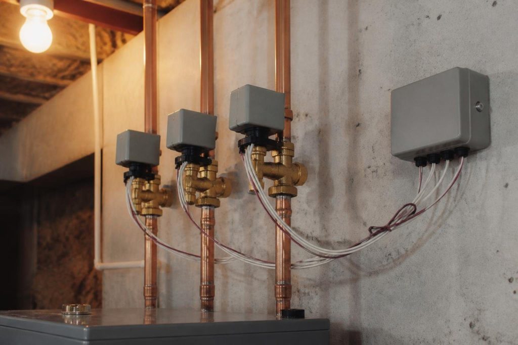 A three-zone hydronic system: one valve per zone on the supply piping.